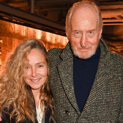 Charles Dance is wearing a blazer as Alessandra Masi is rocking her long hair.